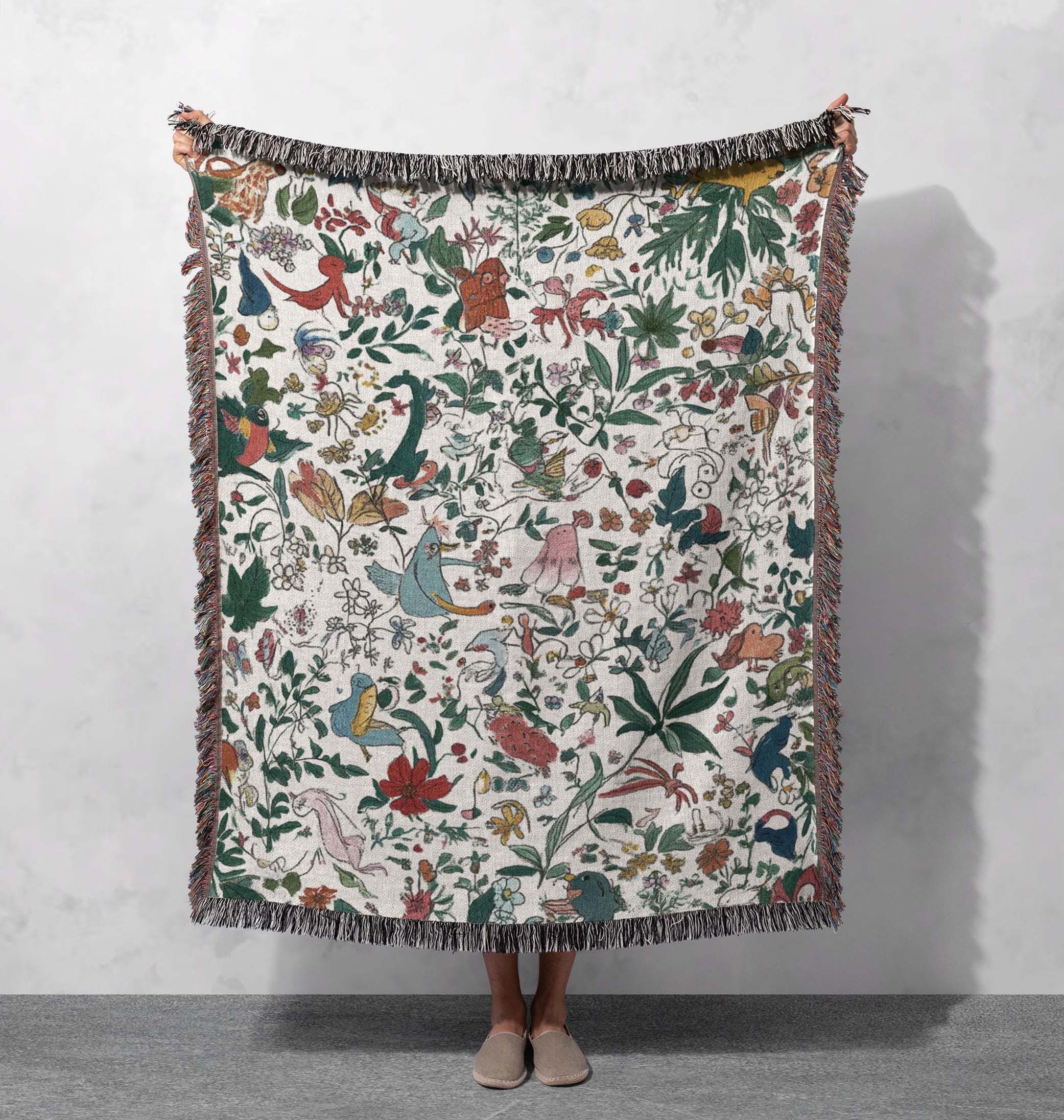 whimsical nature woven blanket with colorful flora and fauna design cozy decorative throw for home and nature lovers tapestry